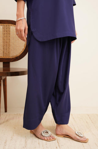 Pants Detail of Raya Solid Blue Co-ord set is made from ultra-soft wash and wear material featuring short shirt with collar and placket details and shalwar with relaxed fit