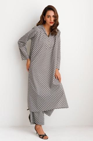 Shopmanto, wear manto pakistani clothing brand women ready to wear manto black and white blocks two piece matching co-ord set with shirt collar and straight trouser pants, random urdu letters calligraphed throughout the set