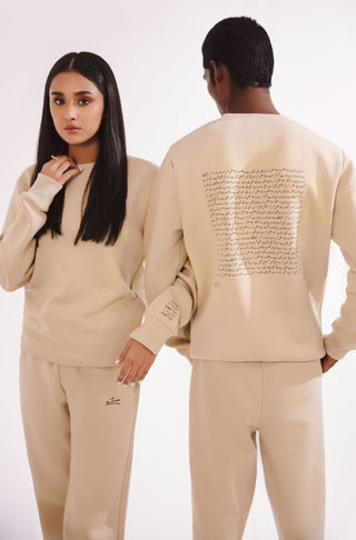 Manto, Pakistan's Most Comfy Ready to Wear Unisex Triple Layered Premium Fleece French Vanilla Talaash Sweatshirt with Urdu Calligraphy of Poetry by Nida Fazli Paired with French Vanilla Jogger Pants