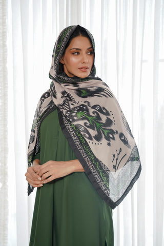 Shopmanto, Pakistani Urdu calligraphy clothing brand, wear Manto ready-to-wear women's Dastoor Swiss Lawn scarf featuring Jigar Moradabadi's poetry in hijab-friendly design, available in black and green.